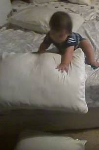 Good thing there are three pillows on the bed! Perfect for stacking.